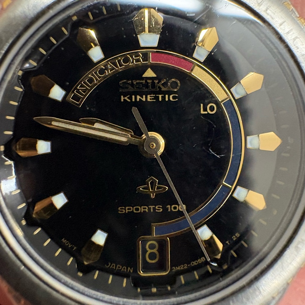 Seiko Kinetic Sports 100 Watch with Black dial and two tone band.  Women’s.